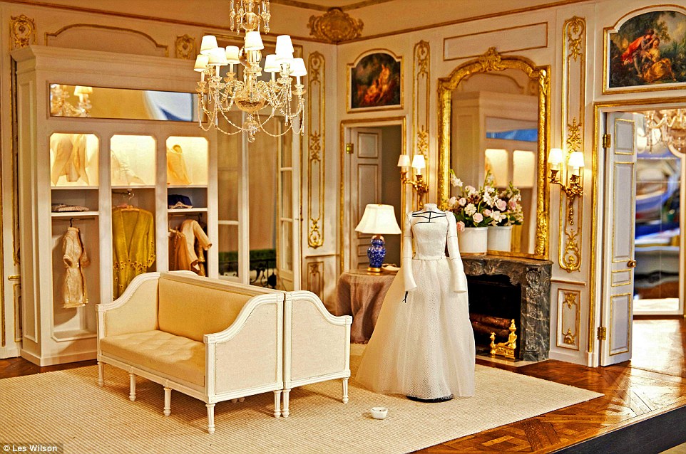 Couture: A dressmaker's dummy stands in an incredibly ornate fitting room