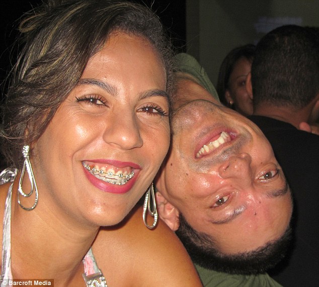 Popular: Claudio has never let his disabilities prevent him from enjoying a full and busy life (pictured with a friend in December last year)