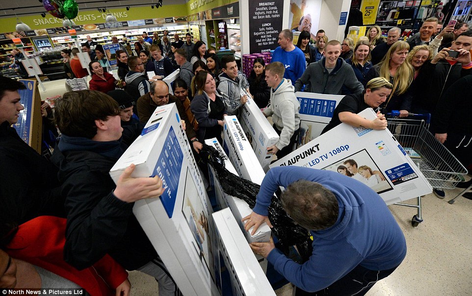 Shoppers flocked to stores across Britain just after midnight to snap up Black Friday bargains, including heavily-discounted flat screen TVs 