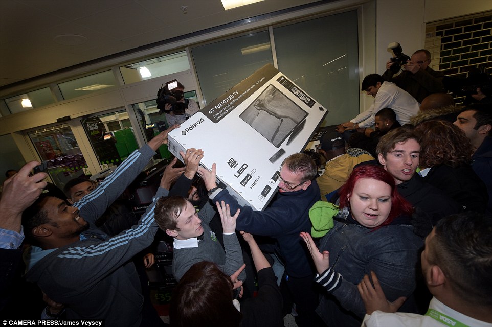 Crowds surged through the store as they battled to purchase one of the Polaroid 40inch HD TVs which is now out of stock across Asda stores