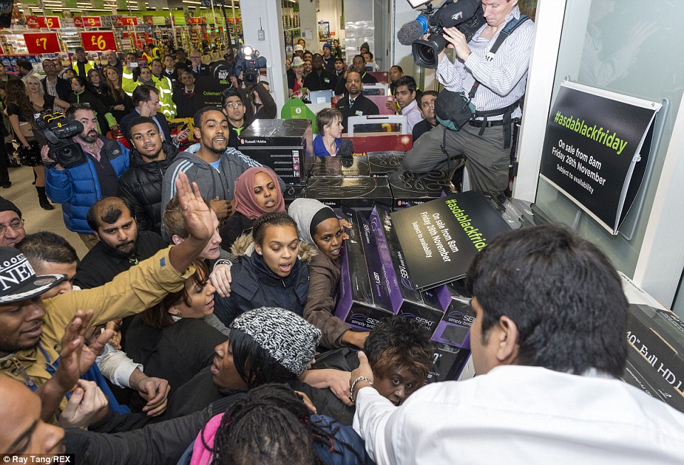 More customers fight over discounted televisions at the Asda store in Wembley, north London. Despite the chaos no arrests were made 