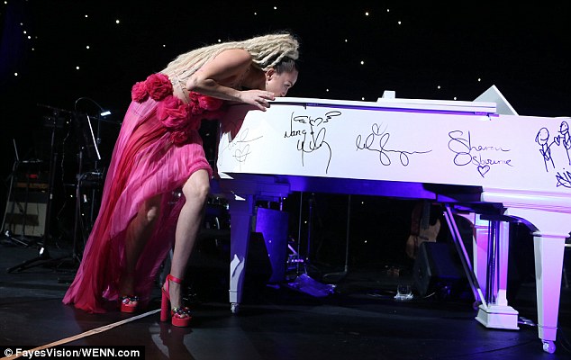 Raunchy and risque: During her acceptance speech, the Wrecking Ball hitmaker - a staunch advocate of LGBT rights - put on a raunchy display as she flashed more than hint of flesh while cavorting around on stage