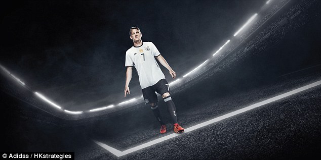 Manchester United and Germany midfielder Bastian Schweinsteiger poses in his new international strip