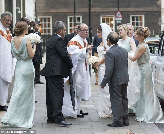 Bridal party: Ms Carneiro's bridesmaids wore pale mint-green sleeveless dresses