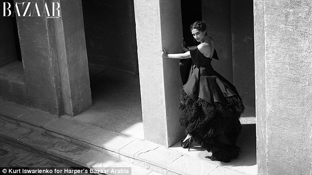 Sonam models a black  couture gown embellished with ostrich feathers by the renowned Saudi Arabian designer Mohammed Ashi 