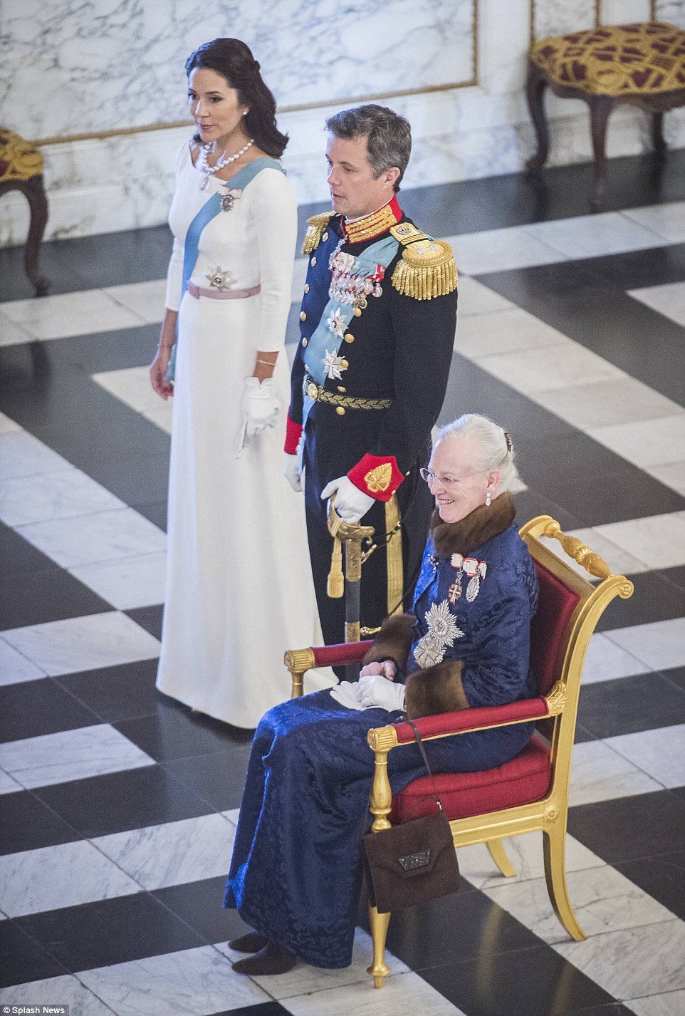 Wowing in ivory: After Prince Henrik's retirement, Queen Margrethe is joined by her son Prince Frederik and Princess Mary